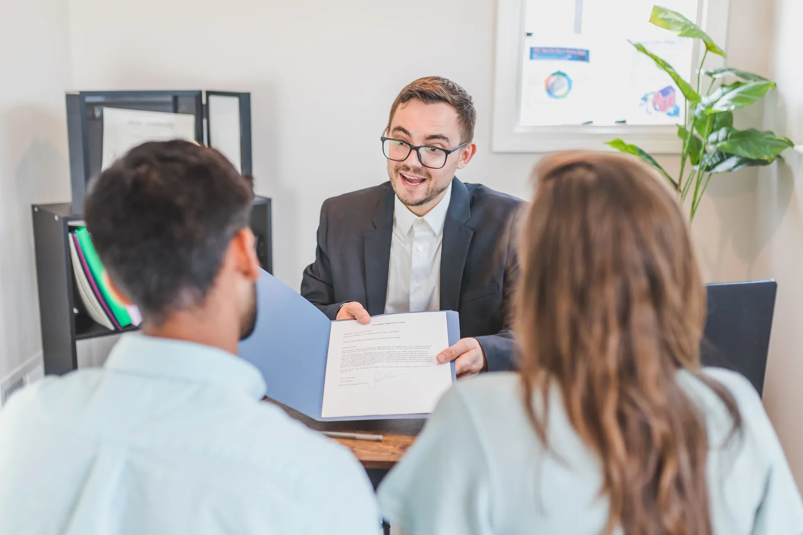 Mortgage professional speaking with a client